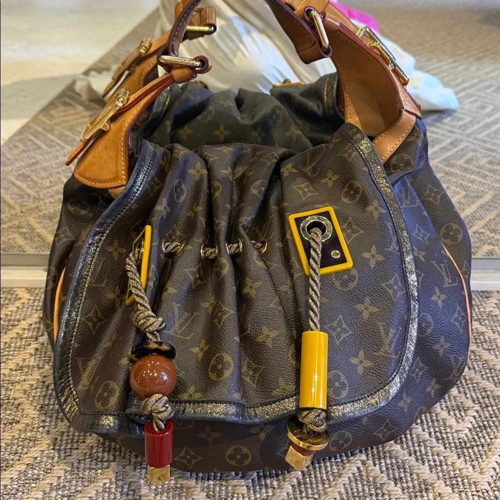 Louis Vuitton Brown Monogram Drawstring Shoulder Bag circa 2009
